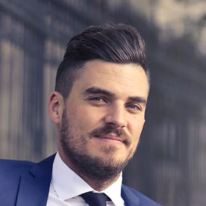 smiling man in suit