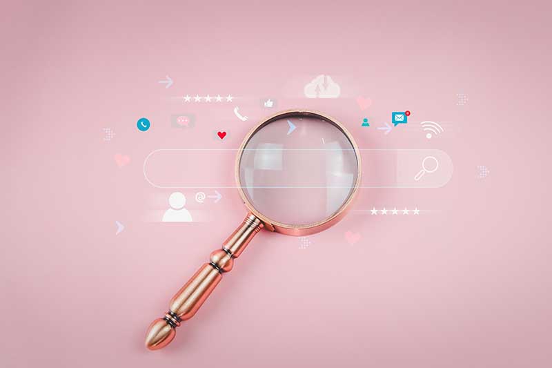 Search Engine Marketing agency quincy ma - magnifying glass with digital overlay of  internet search bar and icons